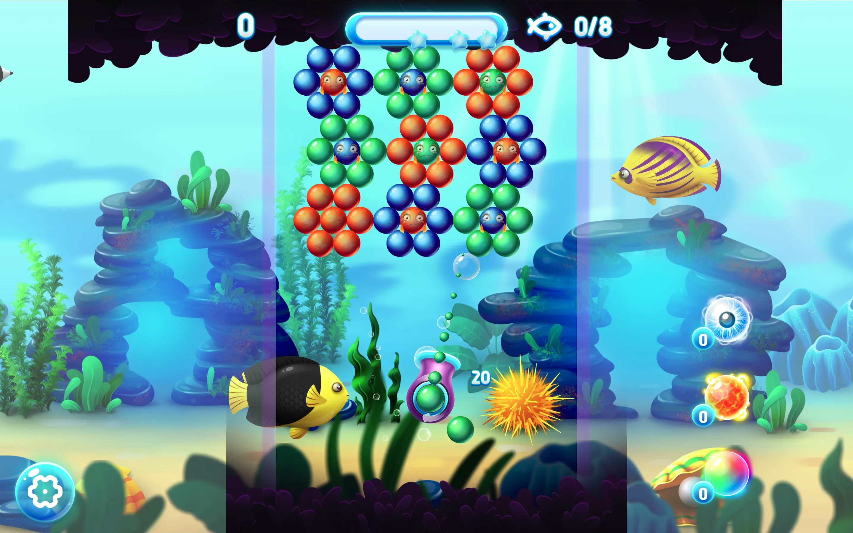 Aqua Pop Bubble Shooter undersea playfield showing nautilus launcher, flower bubble clusters, and trapped baby fish